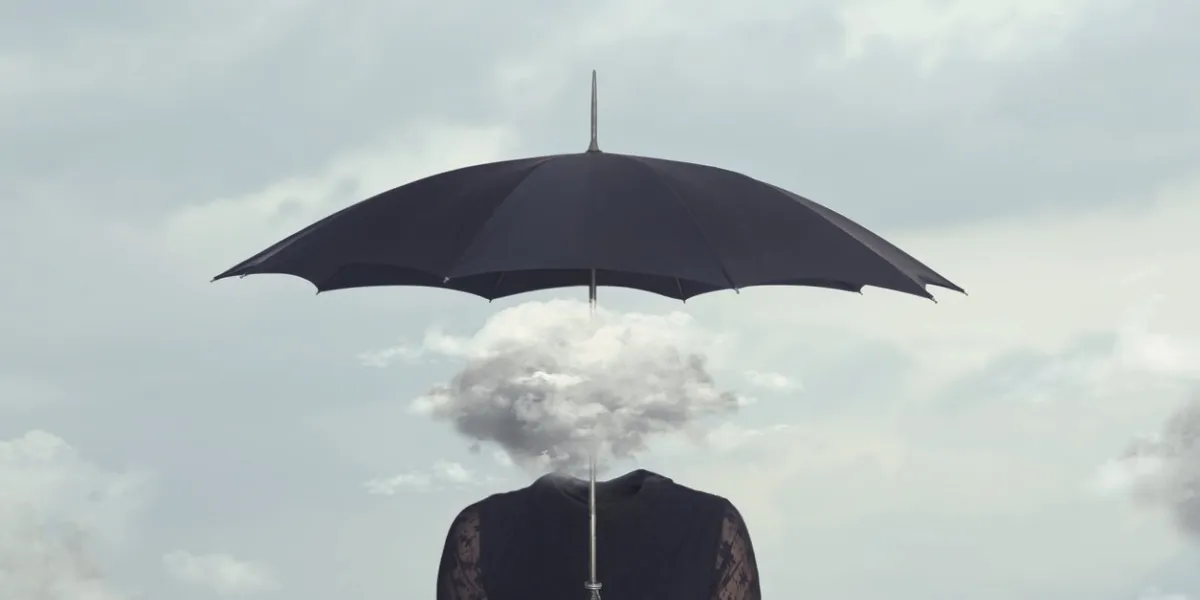 elegant woman with cloud head sheltering herself from the rain with umbrella
