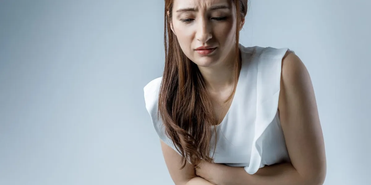 young woman having a stomachache