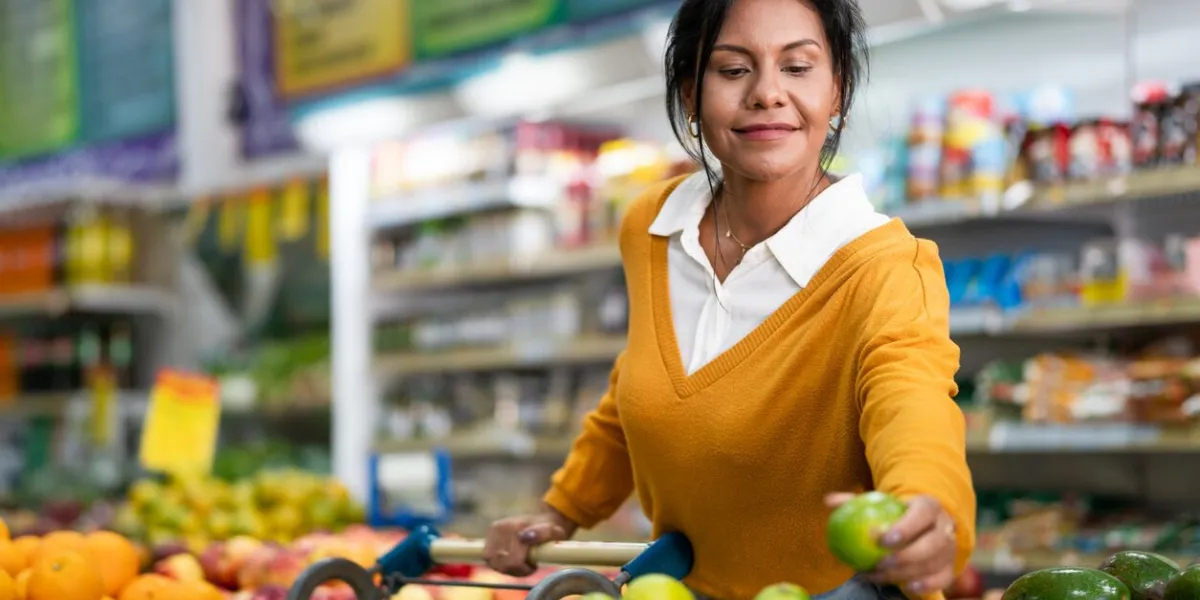 customer chooses lemon in a neighborhood store