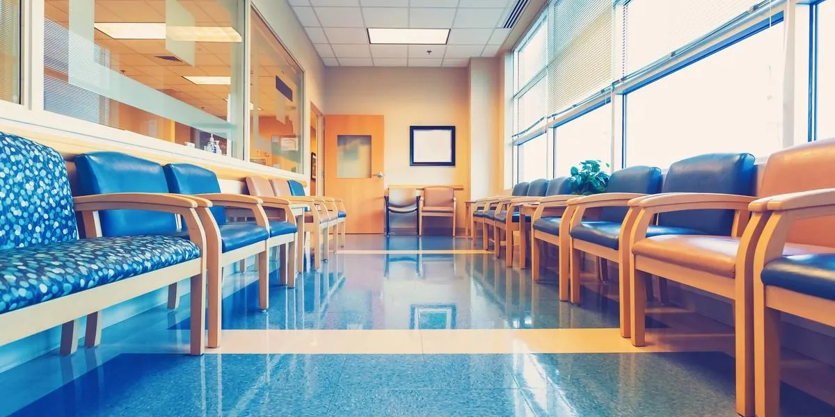 empty blue interior waiting room at medical office
