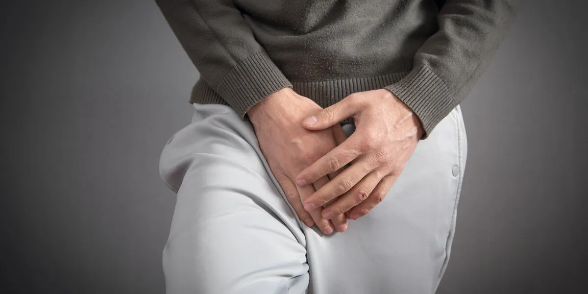 hand holding crotch urinary tract infection cystitis