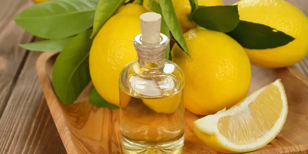 lemon essential oil on a brown background