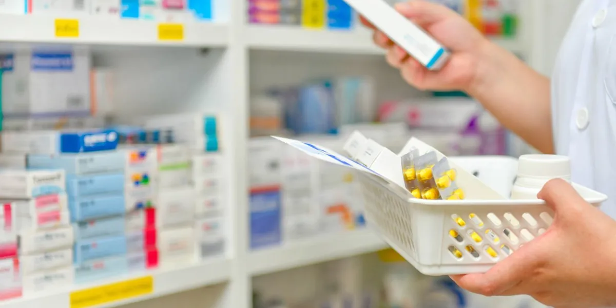 pharmacist filling prescription in pharmacy drugstore