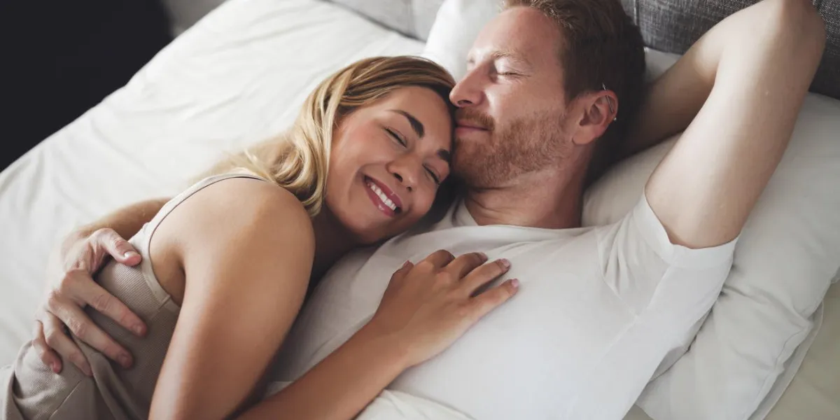 romantic couple in bed being intimate