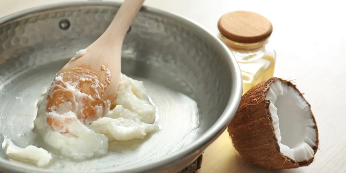 frying pan with coconut oil on table, closeup
