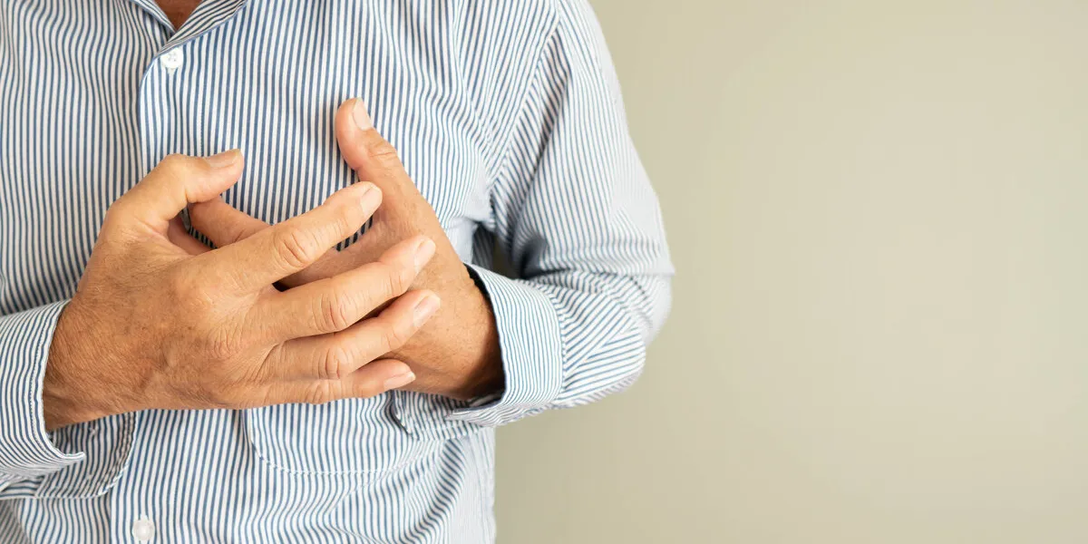 heart attack problems senior man suffering from severe chest pain warning signs of unstable angina or myocardrial infarction disease health care and cardiological concept close up copy space