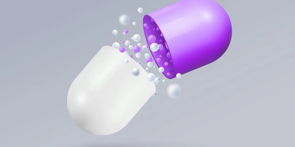 opened pill capsule with falling small rounded molecules realistic medicine pill broken in half 3d style vector illustration