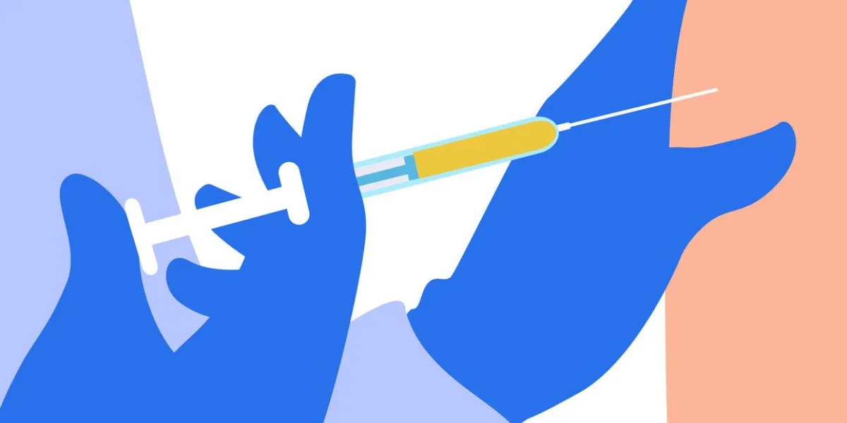 the doctor gives an injection dose of the vaccine into the patient's arm vaccination, antiviral shot injecting vaccinate with a syringe hands in surgical gloves