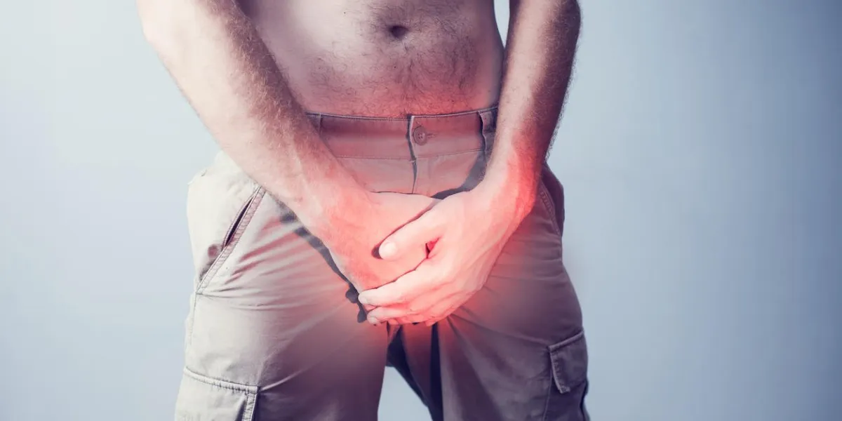 close up young man holding his genitals cause pain, prostate cancer, premature, ejaculation, fertility, bladder problem