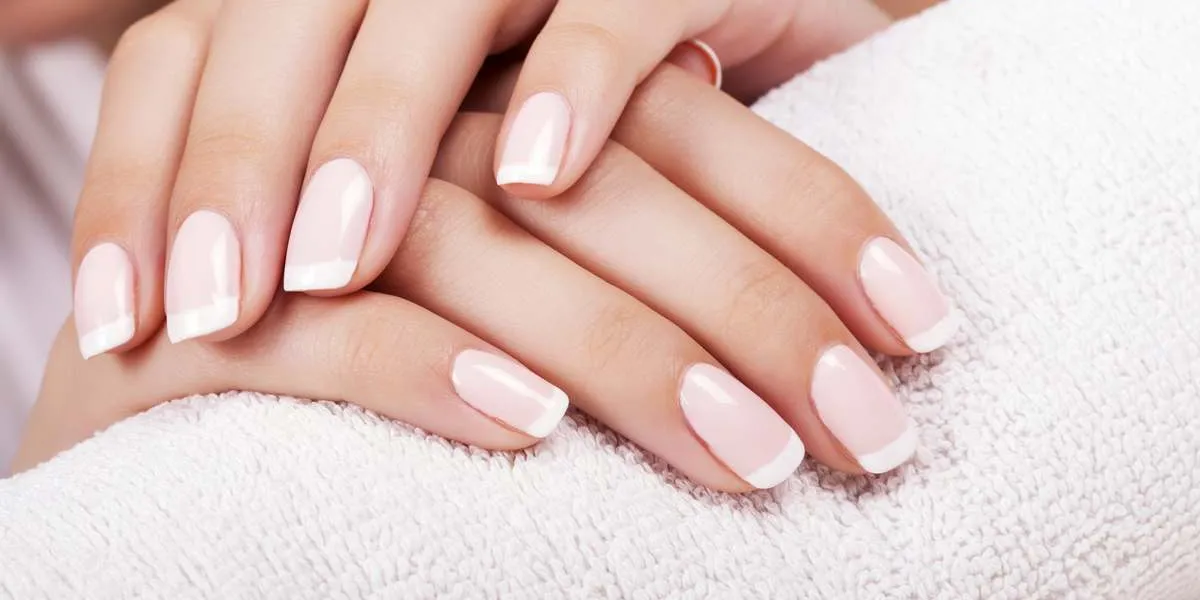 beautiful woman's nails with french manicure