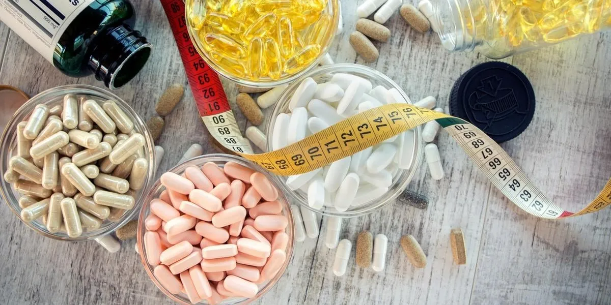 nutritional supplements in capsules and tablets selective focus, shallow dof