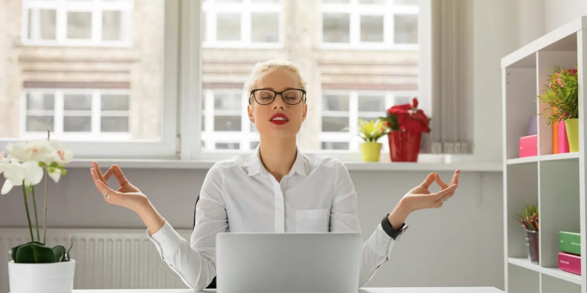 woman in office meditating