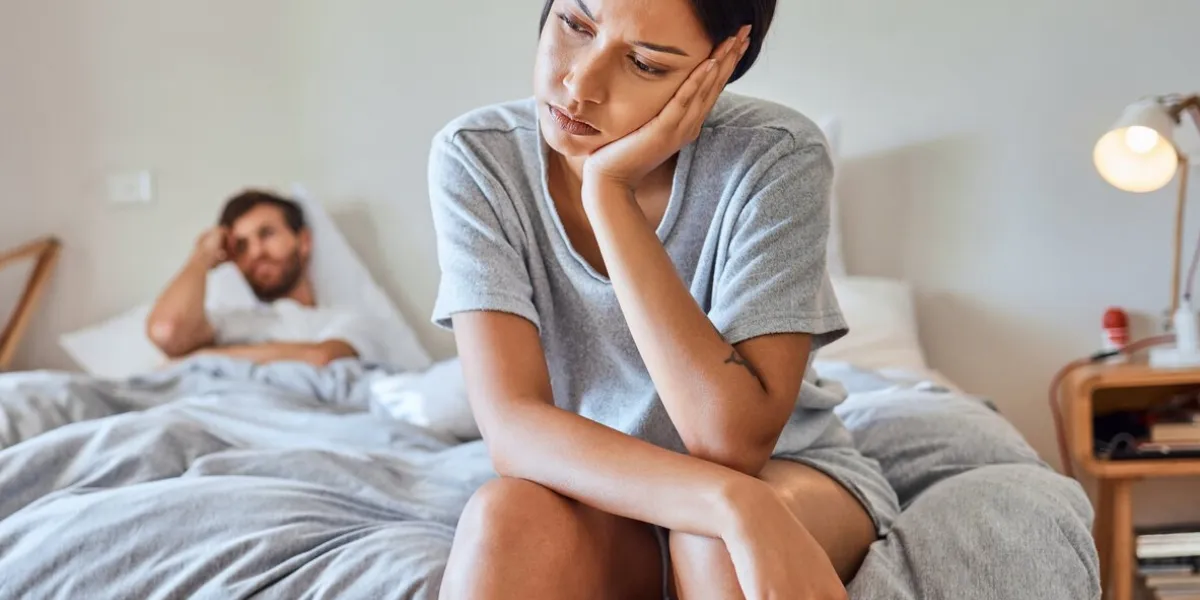 stress, insomnia or depression woman on bed upset, angry and sad after arguing, cheating and relationship problems in home bedroom female feeling tired and thinking about couple conflict problem