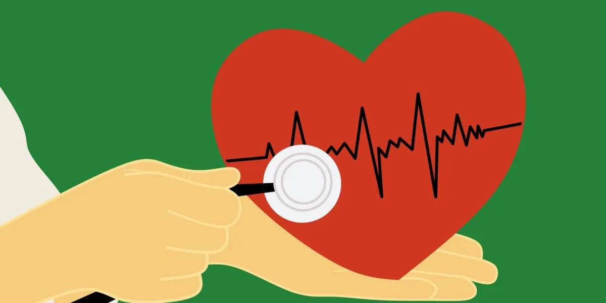 doctor's hand examining the heart with a stethoscope