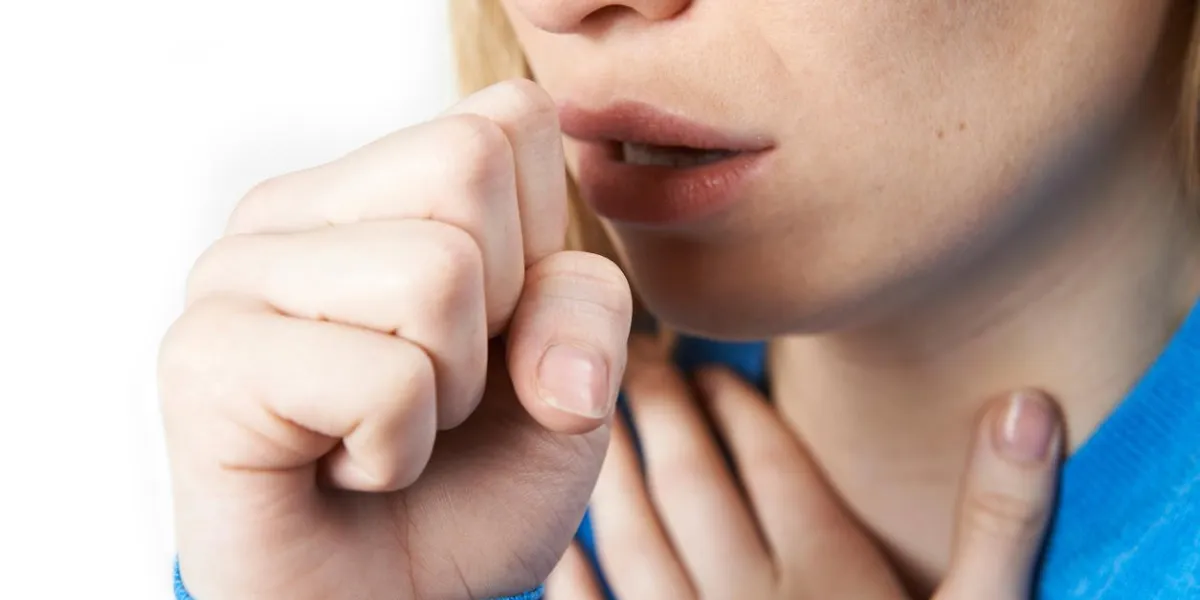 close up of woman suffering with cough
