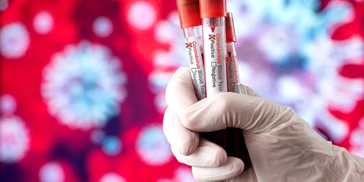 coronavirus blood sample in front of virus background