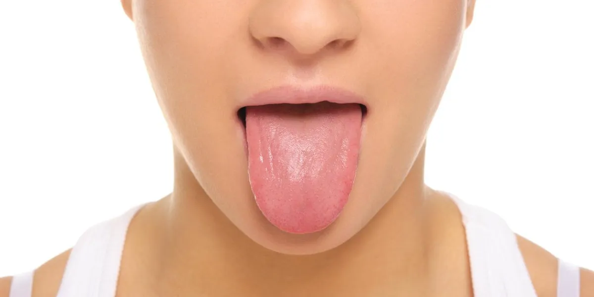 woman stick ones tongue out isolated in white