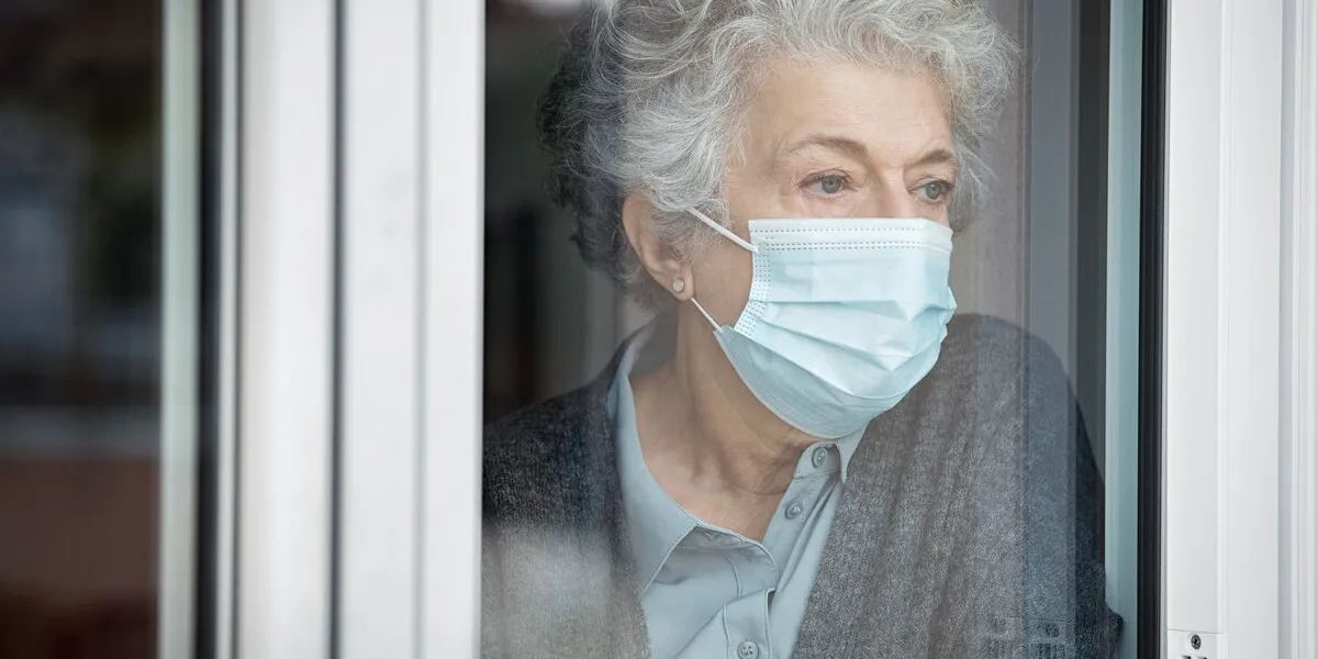 depressed senior woman in quarantine at home suffers from loneli