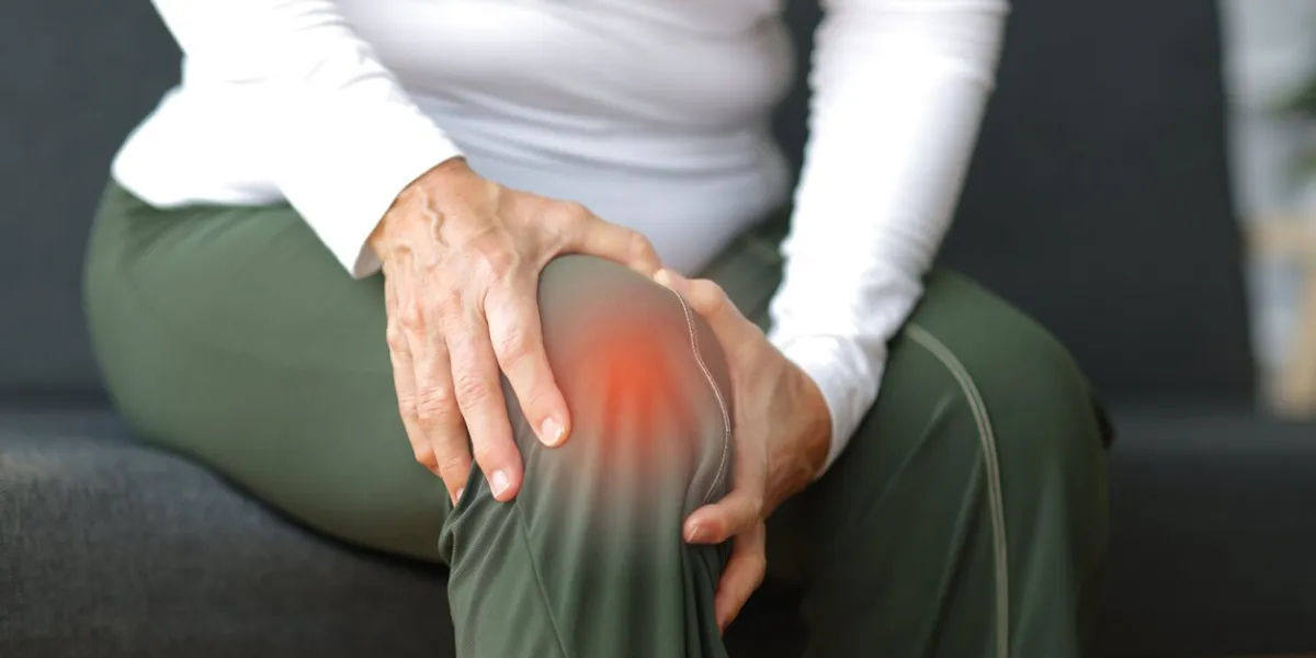 senior woman with osteoarthritis has leg pain