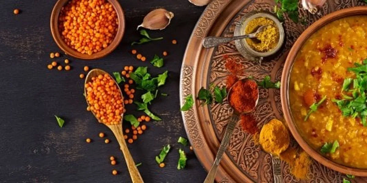 indian dal food traditional indian soup lentils indian dhal spicy curry in bowl, spices, herbs, rustic black wooden background top view authentic indian dish banner flat lay