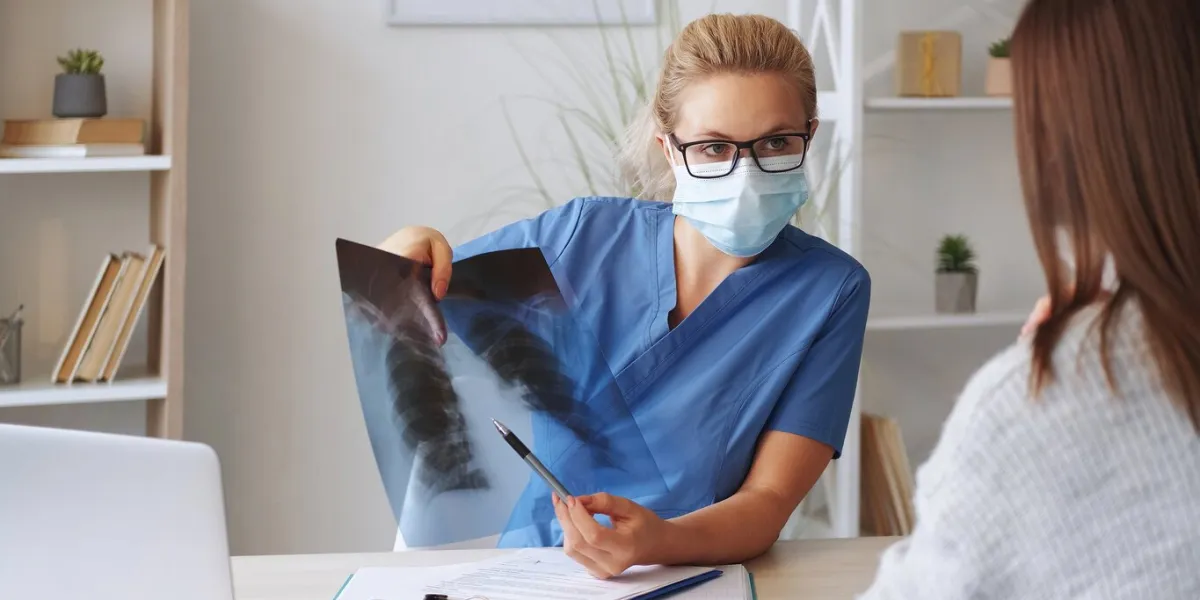 chest radiology x-ray diagnostic woman doctor examining lung film scan at radiology department in hospital detection for covid