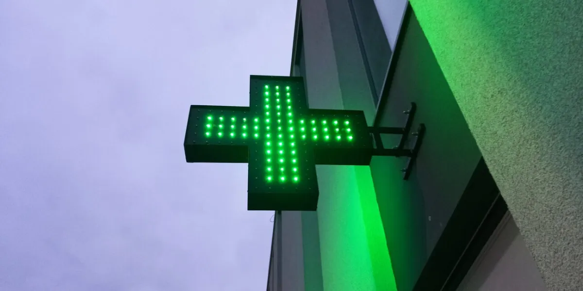 green pharmacy electric sign outside
