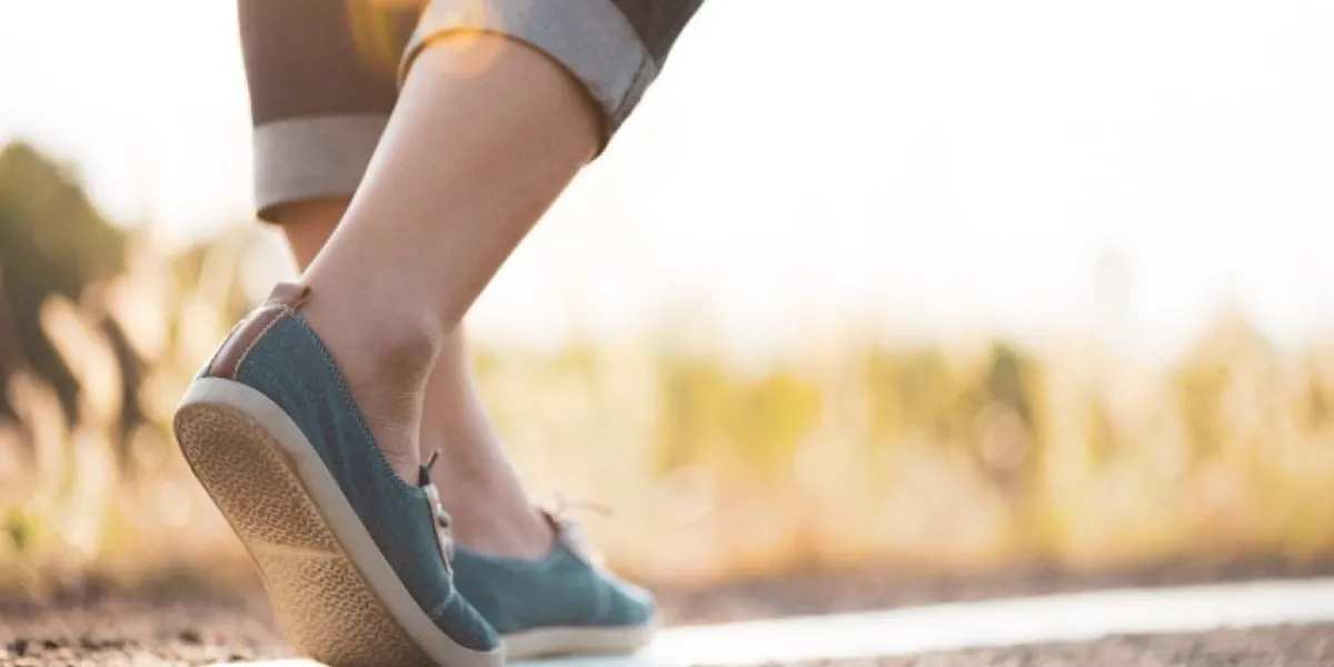 closeup woman walking towards on the road side step concept