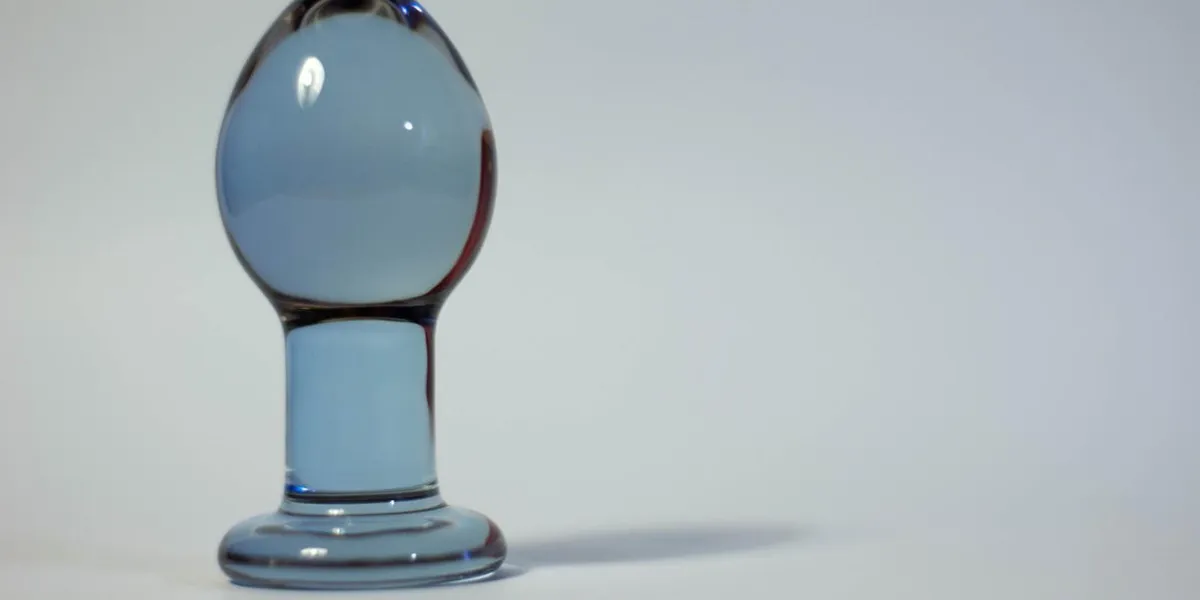 big butt plug transparent glass on a white background