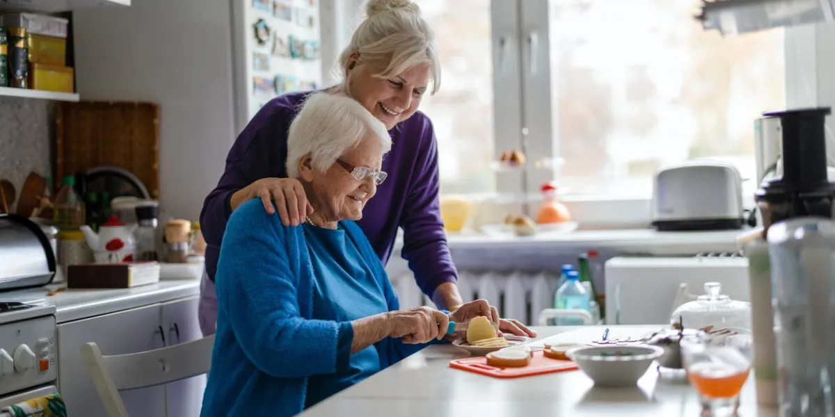 woman spending time with her elderly mother at home