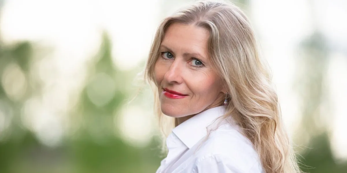 portrait of a beautiful european middle-aged woman fifty-year-old blonde woman with a well-groomed face close-up