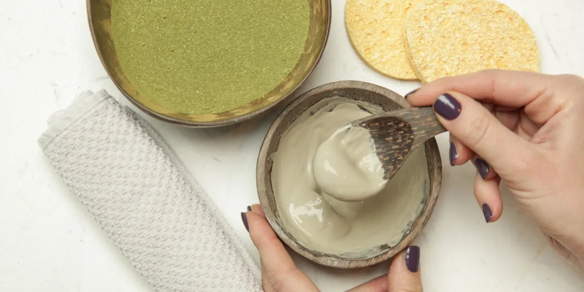 making homemade green clay facial beauty mask
