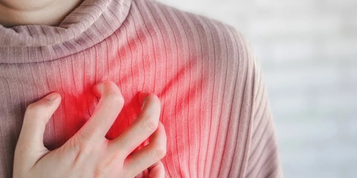 asian woman hand touching her chest having heart attack, healthcare and medical concept