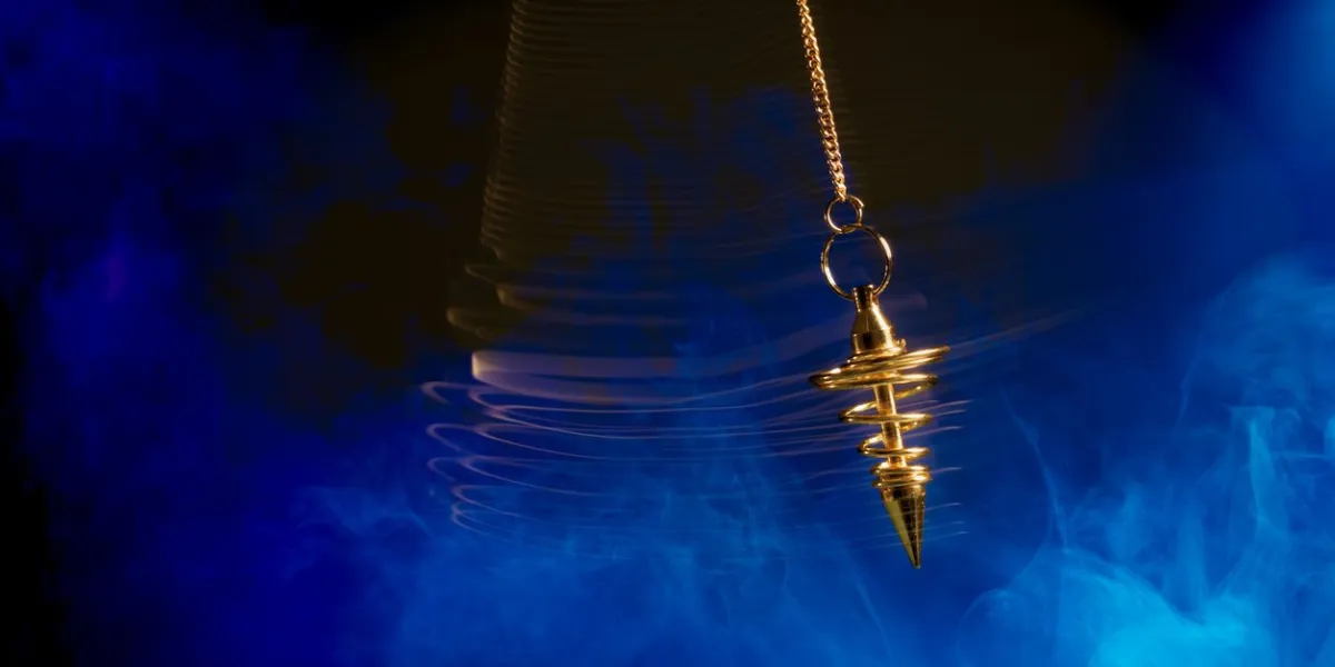 pendulum used for hypnotism and readings swinging with motion blur
