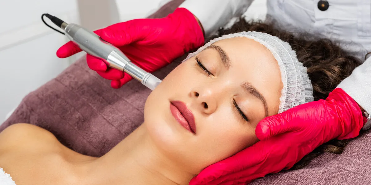beautiful woman receiving microneedling rejuvenation treatment mesotherapy