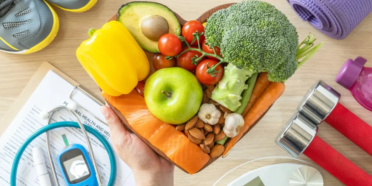 healthy lifestyle on ketogenic diet, eating clean keto food good health dietary in heart dish with aerobic body exercise, gym workout training class , weight scale and sports shoes in fitness center