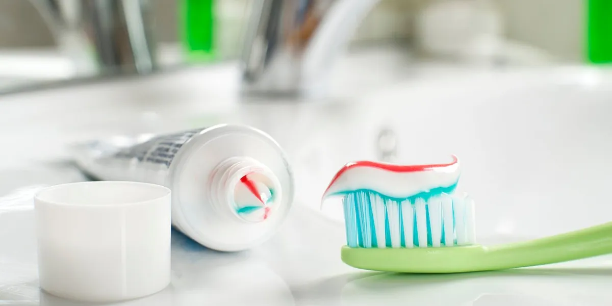 toothbrush and toothpaste in the bathroom close up