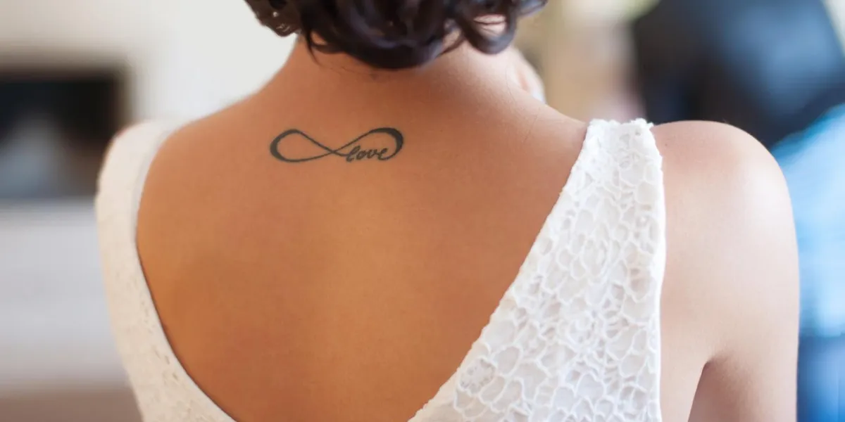 tattoo on back girl with word love