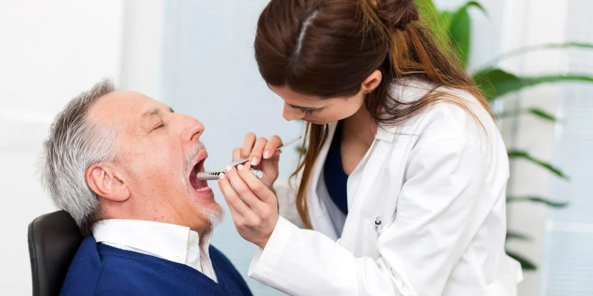 doctor examining a patient in her office
