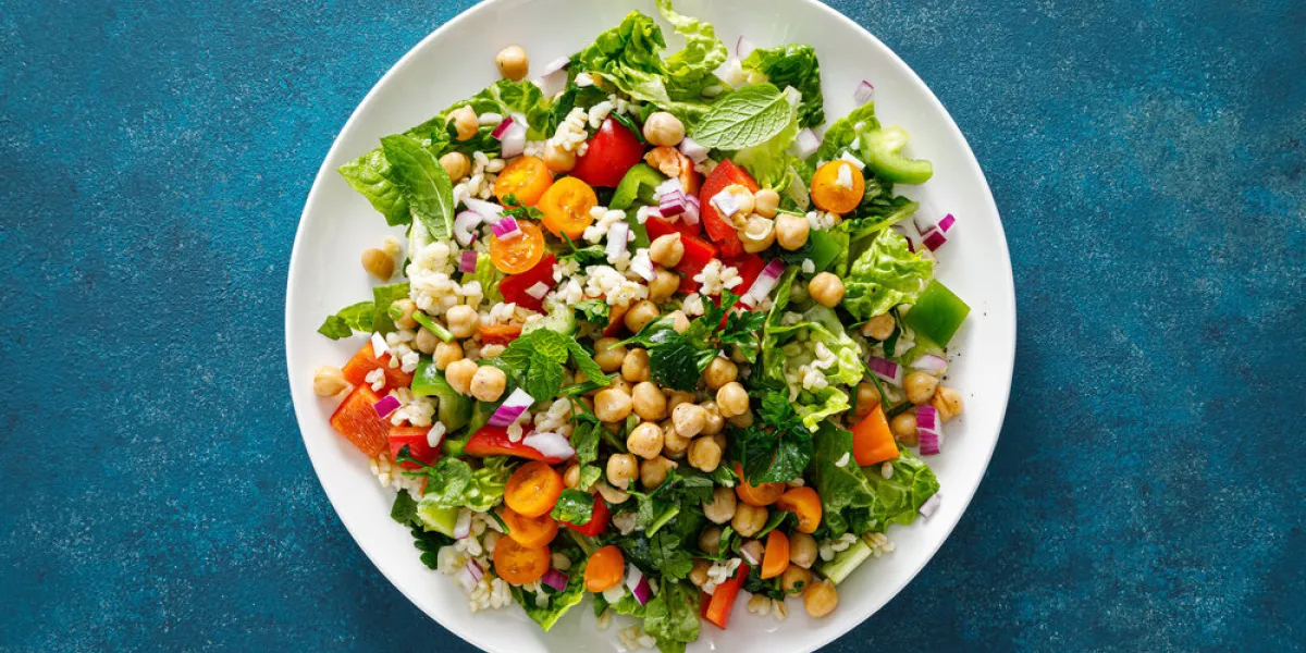 tabbouleh salad tabouli salad with fresh parsley, onions, tomatoes, bulgur and chickpea healthy vegetarian food, diet top view
