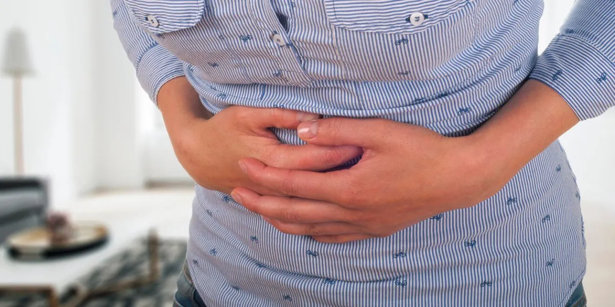 health care concept belly ache young female suffering from strong stomach ache abdominal pain