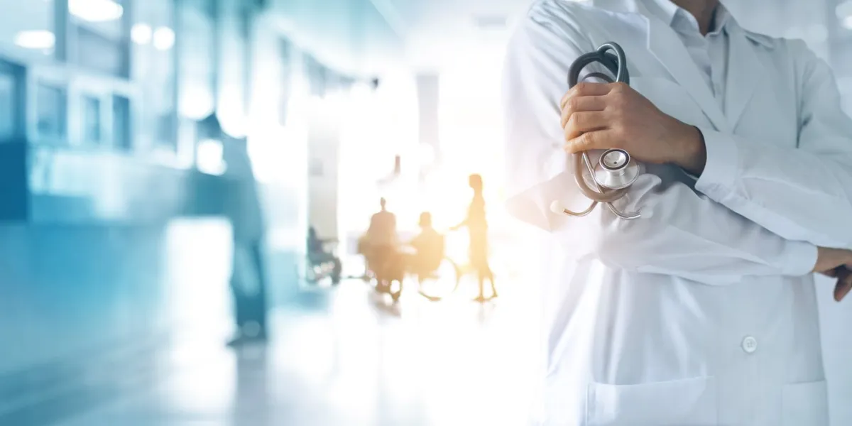 healthcare and medical concept medicine doctor with stethoscope in hand and patients come to the hospital background