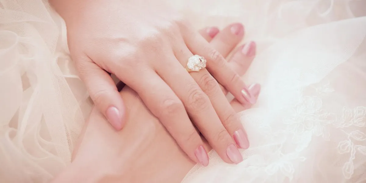 diamond ring on a finger