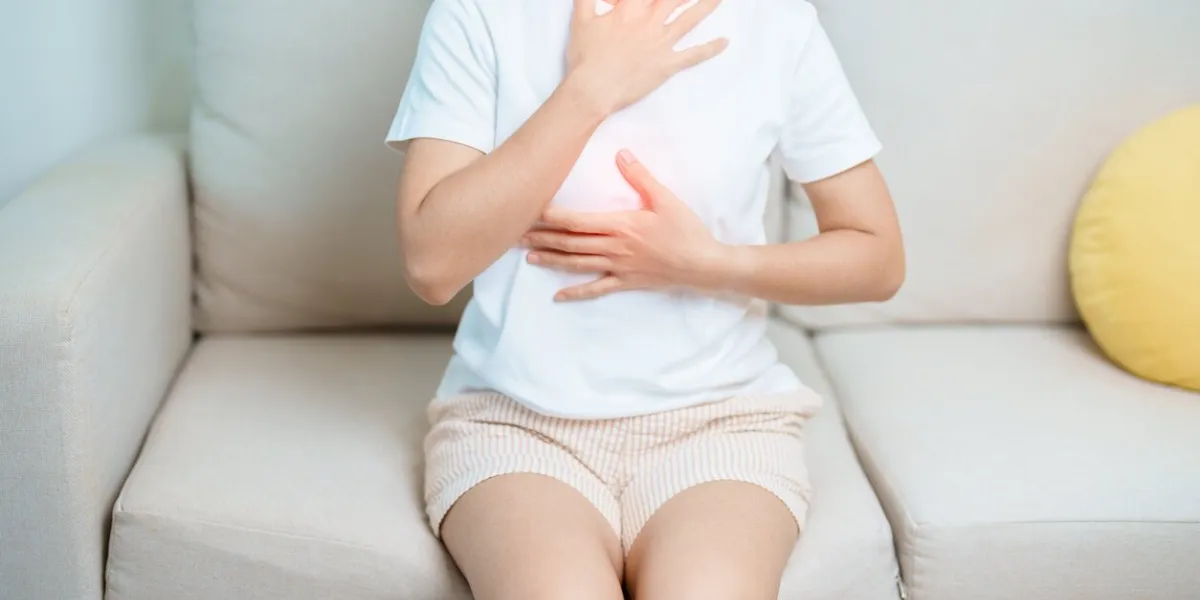 gastroesophageal reflux disease or gerd, acid reflux disease, gastro oesophageal or gord and dyspepsia concept woman having stomach ache and esophageal pain due to digestion system problem