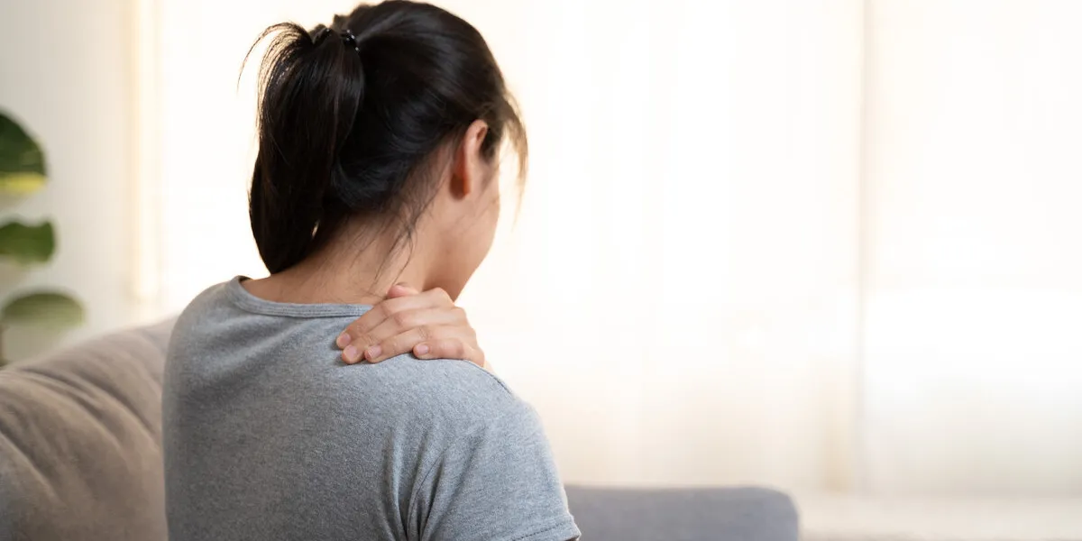 tired woman touch stiff neck feeling hurt joint back pain rubbin