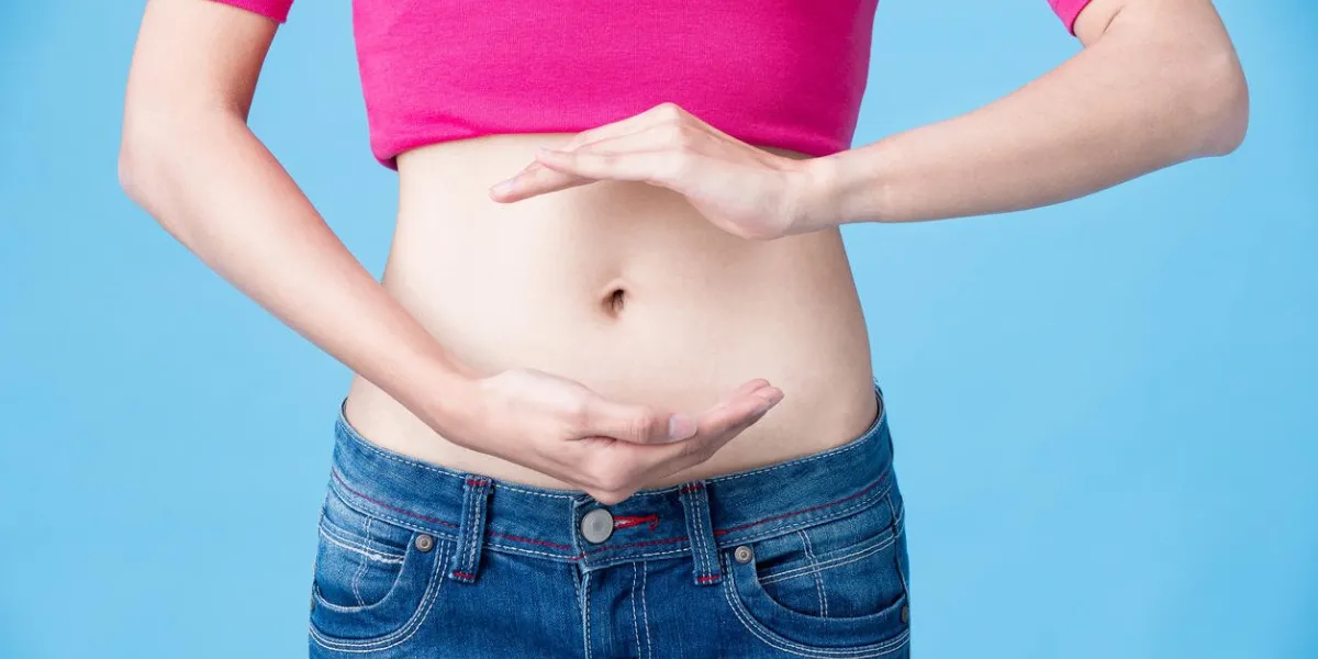 woman cares for her body on the blue background