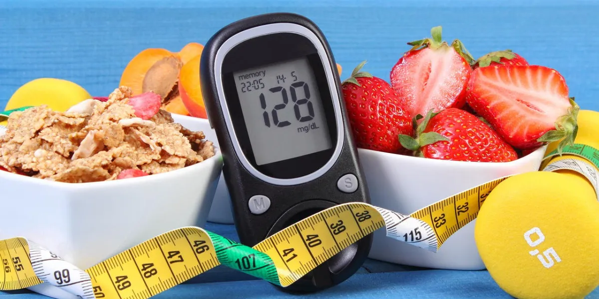 glucometer with result of measurement sugar level, healthy food, dumbbells for fitness and tape measure, concept of diabetes, slimming, healthy lifestyle