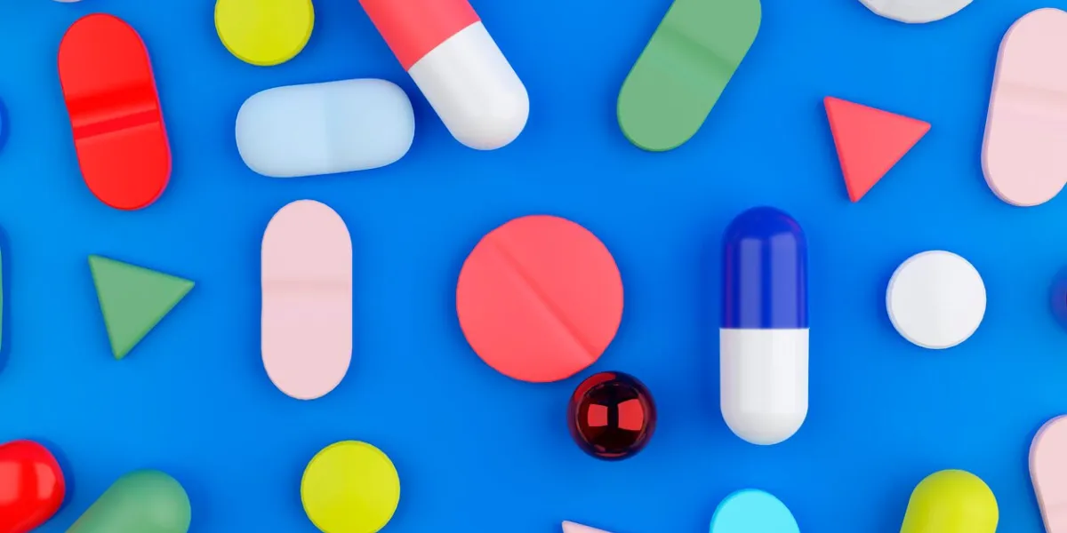 a background filled with various medical pills and health capsules 3d render illustration