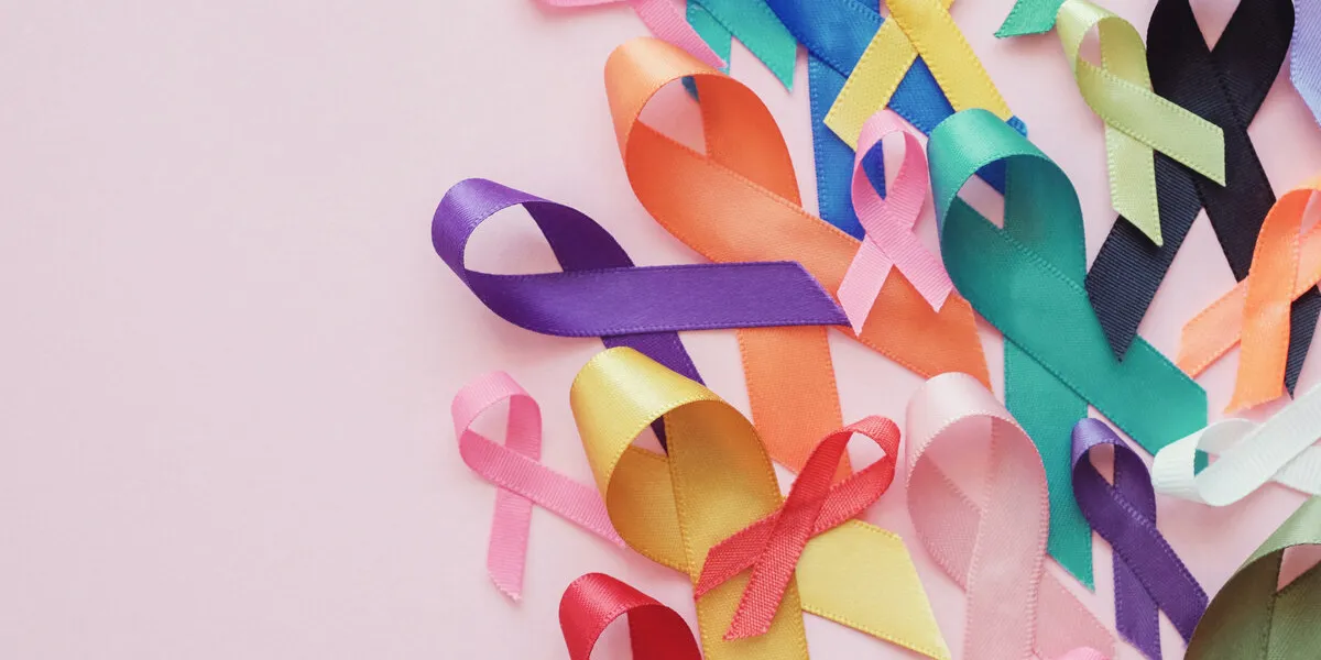 colorful ribbons on pink background, cancer awareness, world cancer day