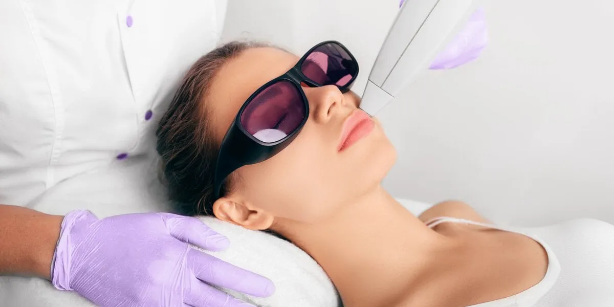 woman getting hair laser epilation, removing hair on face