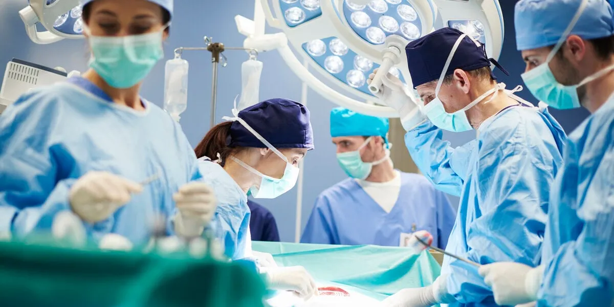 group of surgeons in operating room